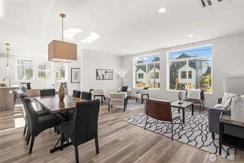 a view of a dining room with furniture window and outside view
