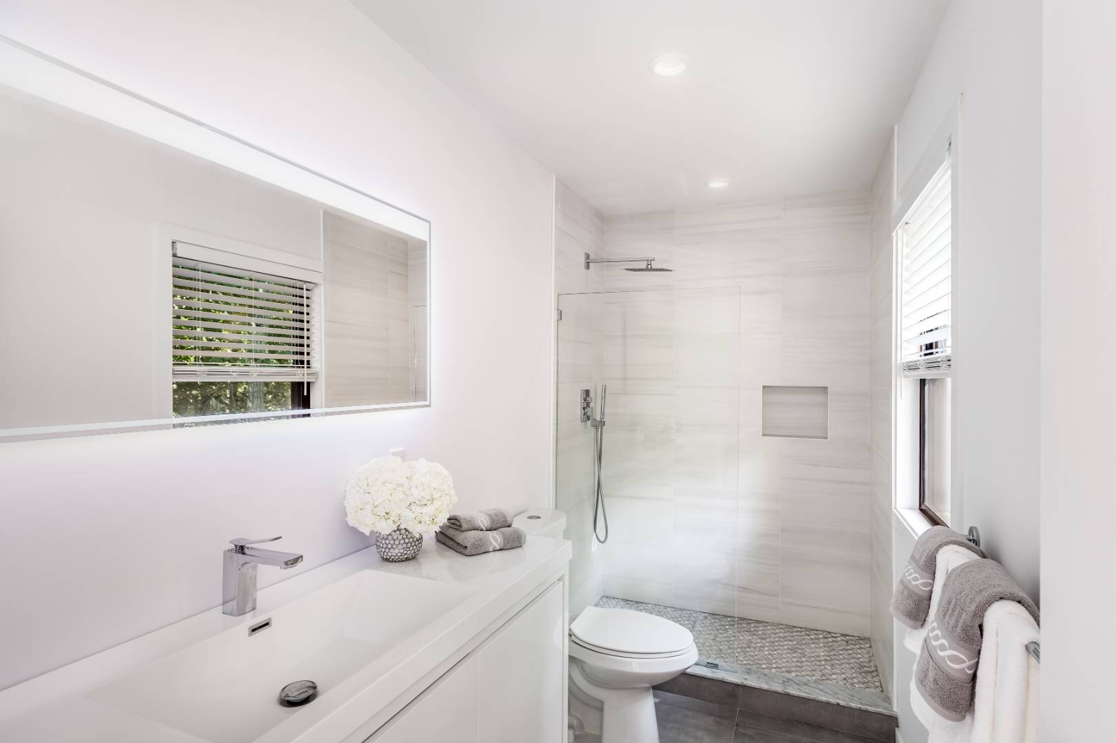 99 Isle Of Wight Road East Hampton, NY 11937 - Photo 15 of 24 a bathroom with a sink a toilet and shower