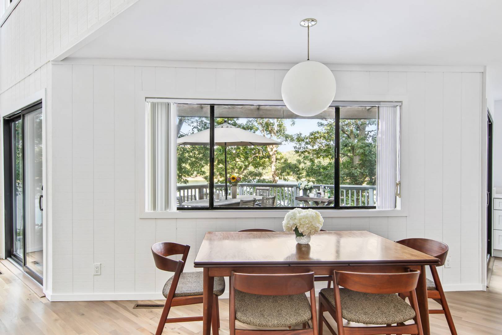 99 Isle Of Wight Road East Hampton, NY 11937 - Photo 10 of 24 a view of a dining room with furniture window and outside view