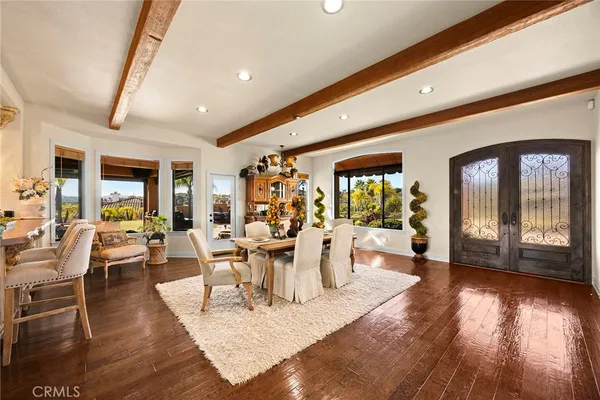 a living room with fireplace furniture and a large window