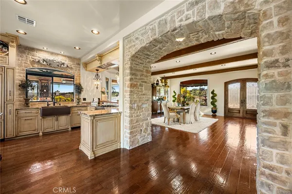 a living room with fireplace furniture and a large window