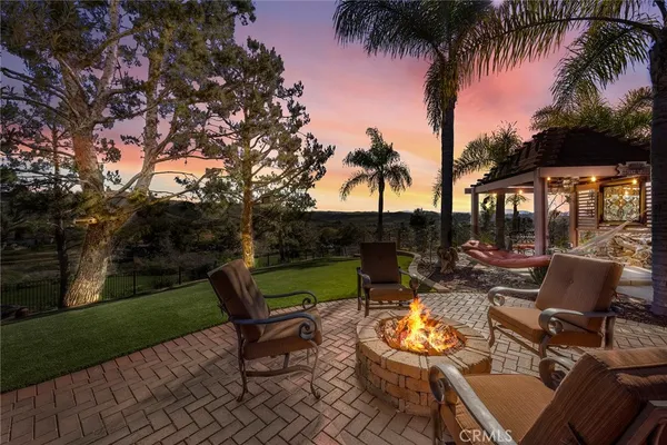 a view of a backyard with sitting area and slide