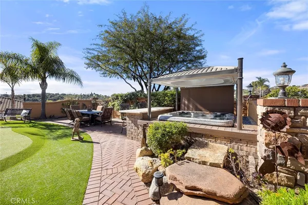 a view of a swimming pool with a yard
