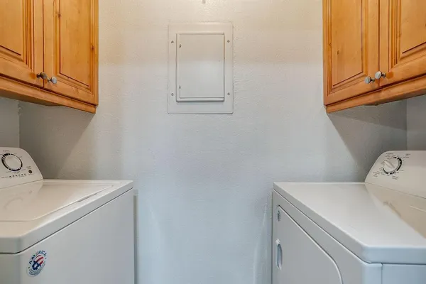 a utility room with dryer and washer