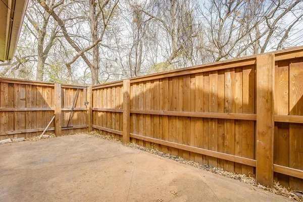 a view of outdoor space with wooden fence