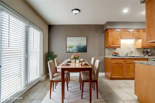 a dining room with furniture and window