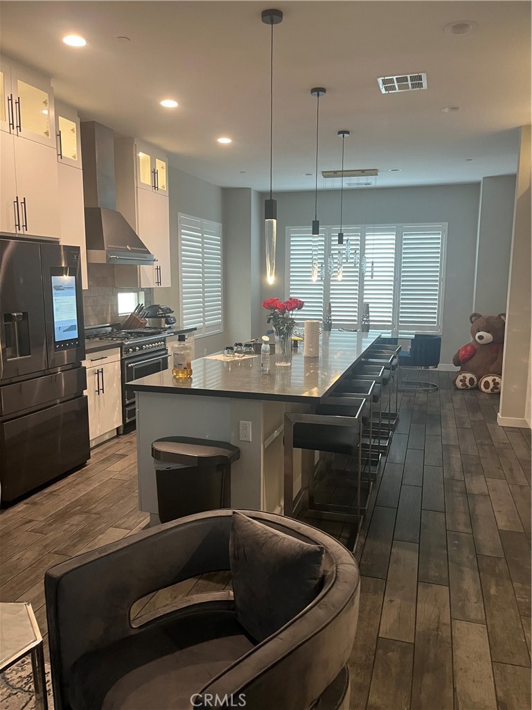 21 Ebb Tide Circle Newport Beach, CA 92663 - Photo 11 of 24 a kitchen with a sink stainless steel appliances and cabinets