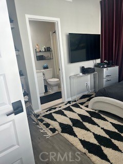 21 Ebb Tide Circle Newport Beach, CA 92663 - Photo 17 of 24 a bedroom with a bed and a flat tv screen on dresser