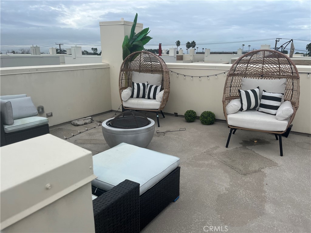 21 Ebb Tide Circle Newport Beach, CA 92663 - Photo 19 of 24 a living room with furniture and a table