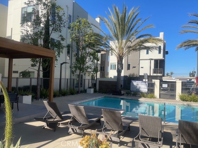 21 Ebb Tide Circle Newport Beach, CA 92663 - Photo 23 of 24 a view of a patio with couches table and chairs and potted plants