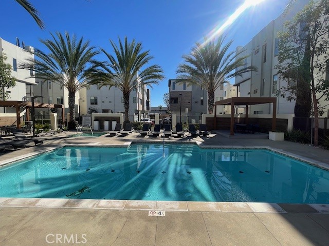 21 Ebb Tide Circle Newport Beach, CA 92663 - Photo 6 of 24 a swimming pool with outdoor seating and yard