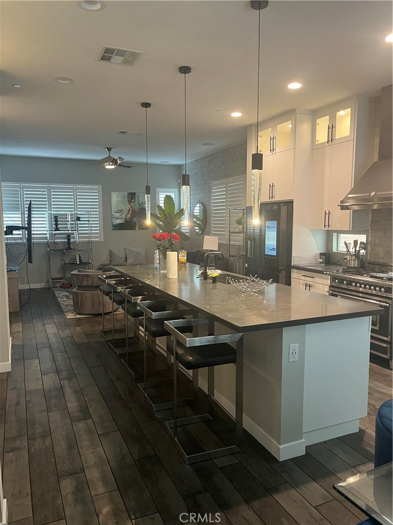 21 Ebb Tide Circle Newport Beach, CA 92663 - Photo 10 of 24 a kitchen with sink stove and cabinets