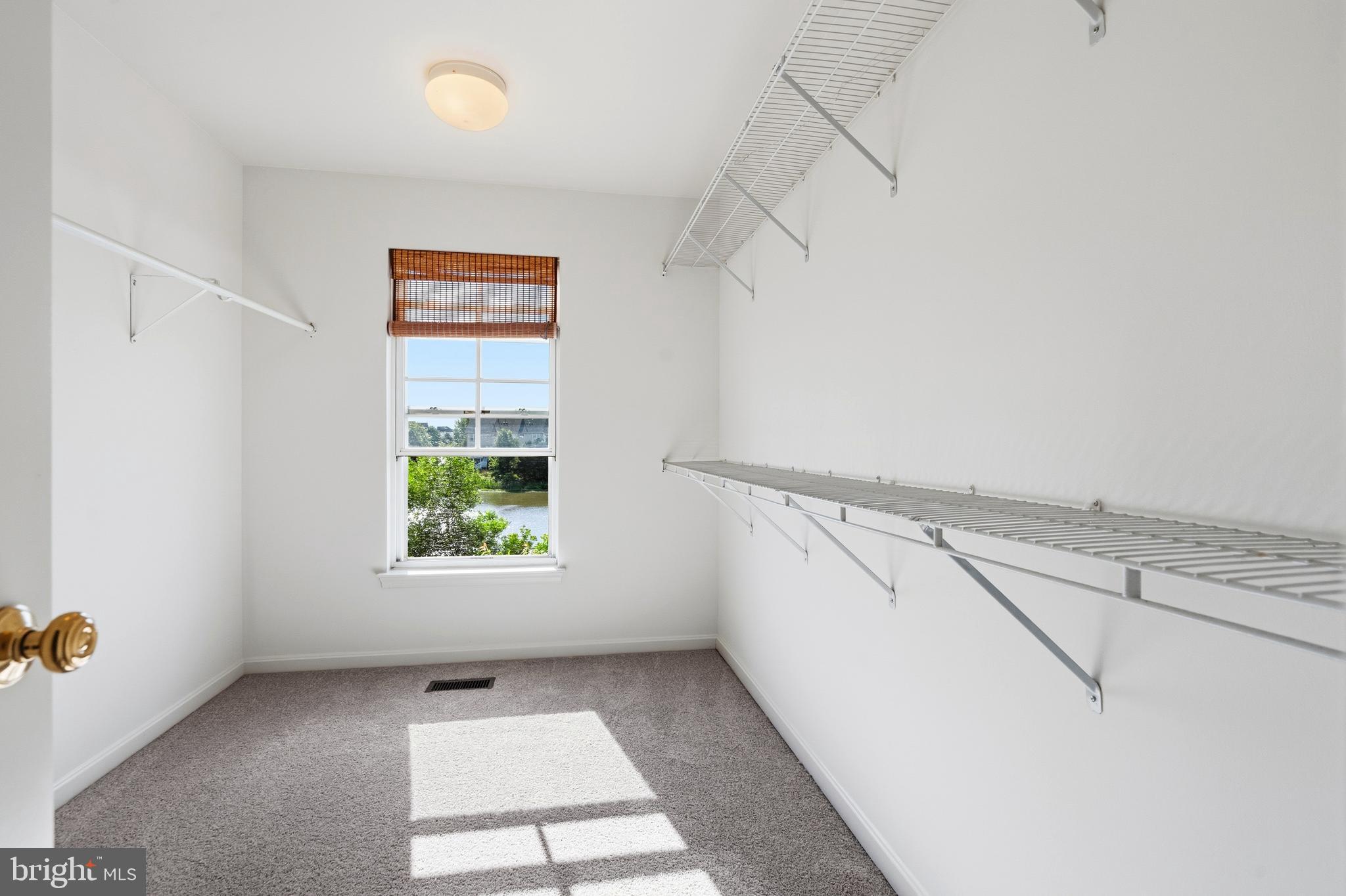 9227 Ribbon Falls Loop Bristow, VA 20136 - Photo 43 of 53 a view of a room with racks on the wall
