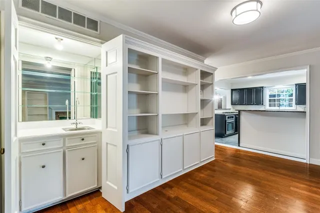 a room with cabinets and wooden floor