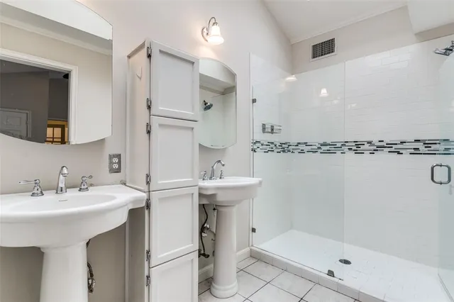 a bathroom with a sink mirror and a bathtub