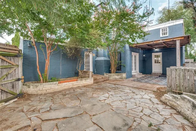 a view of a house with a tree