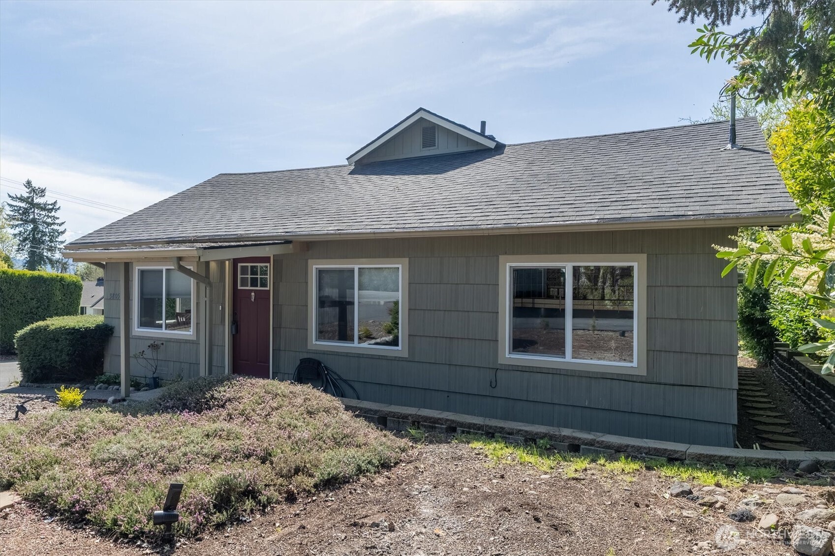 3805 Pacific Way Longview, WA 98632 - Photo 3 of 37 a front view of a house with a yard