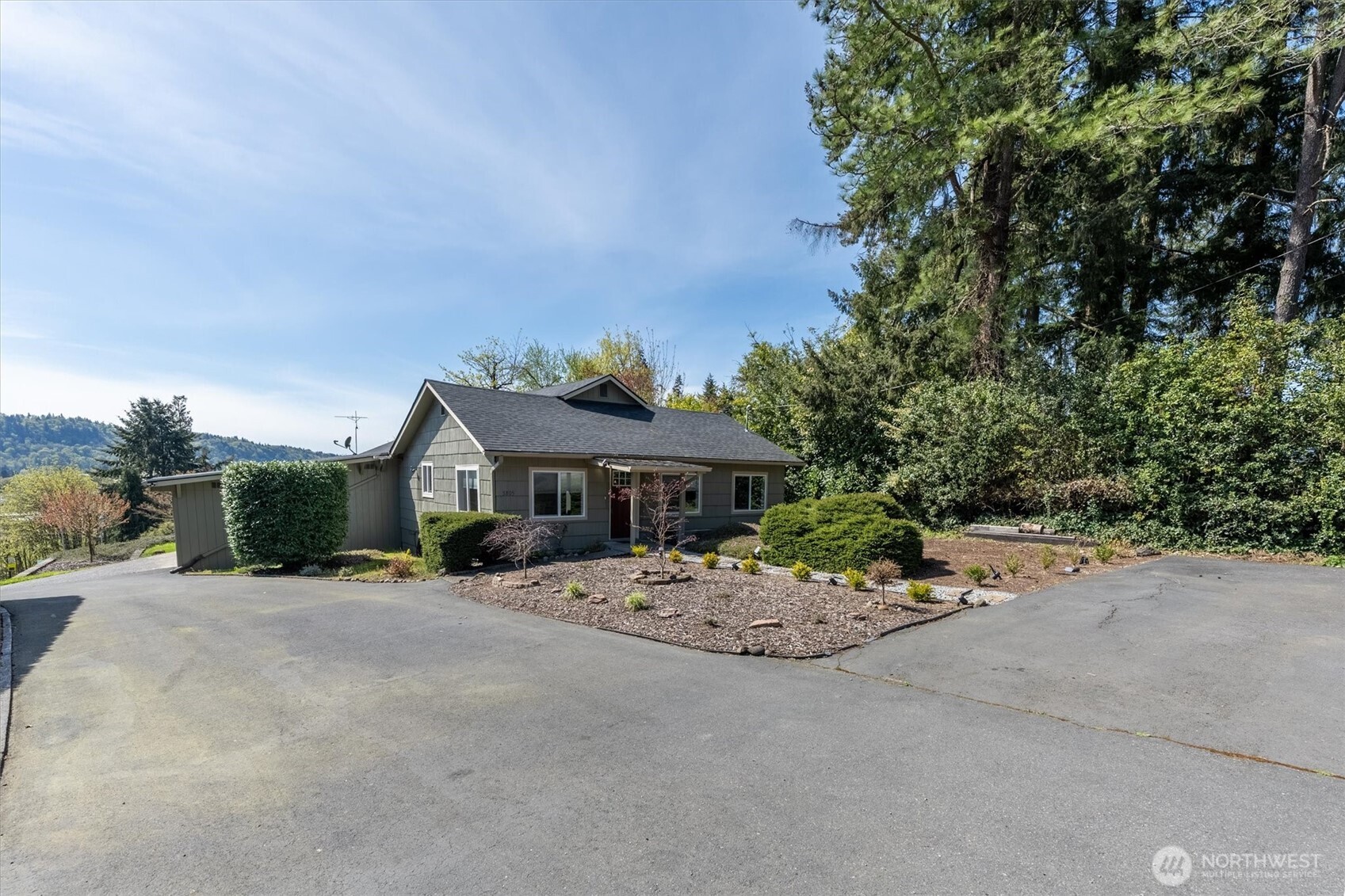 3805 Pacific Way Longview, WA 98632 - Photo 5 of 37 a view of a house with a small yard and large tree