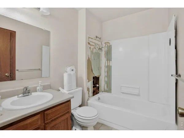 a bathroom with a sink toilet a shower and a mirror