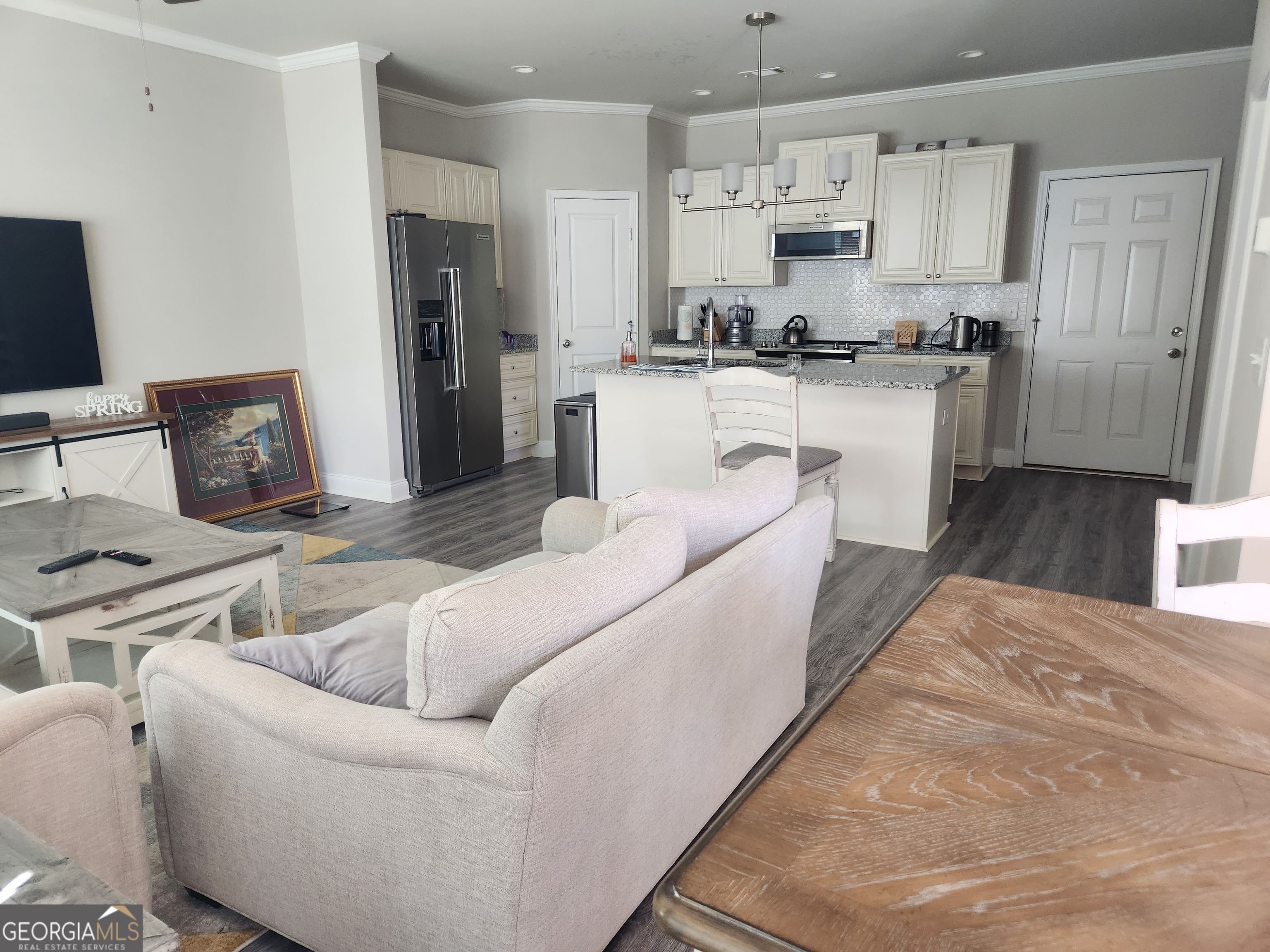 302 Cashes Drive Lilburn, GA 30047 - Photo 2 of 4 a living room with stainless steel appliances furniture a refrigerator and a kitchen view