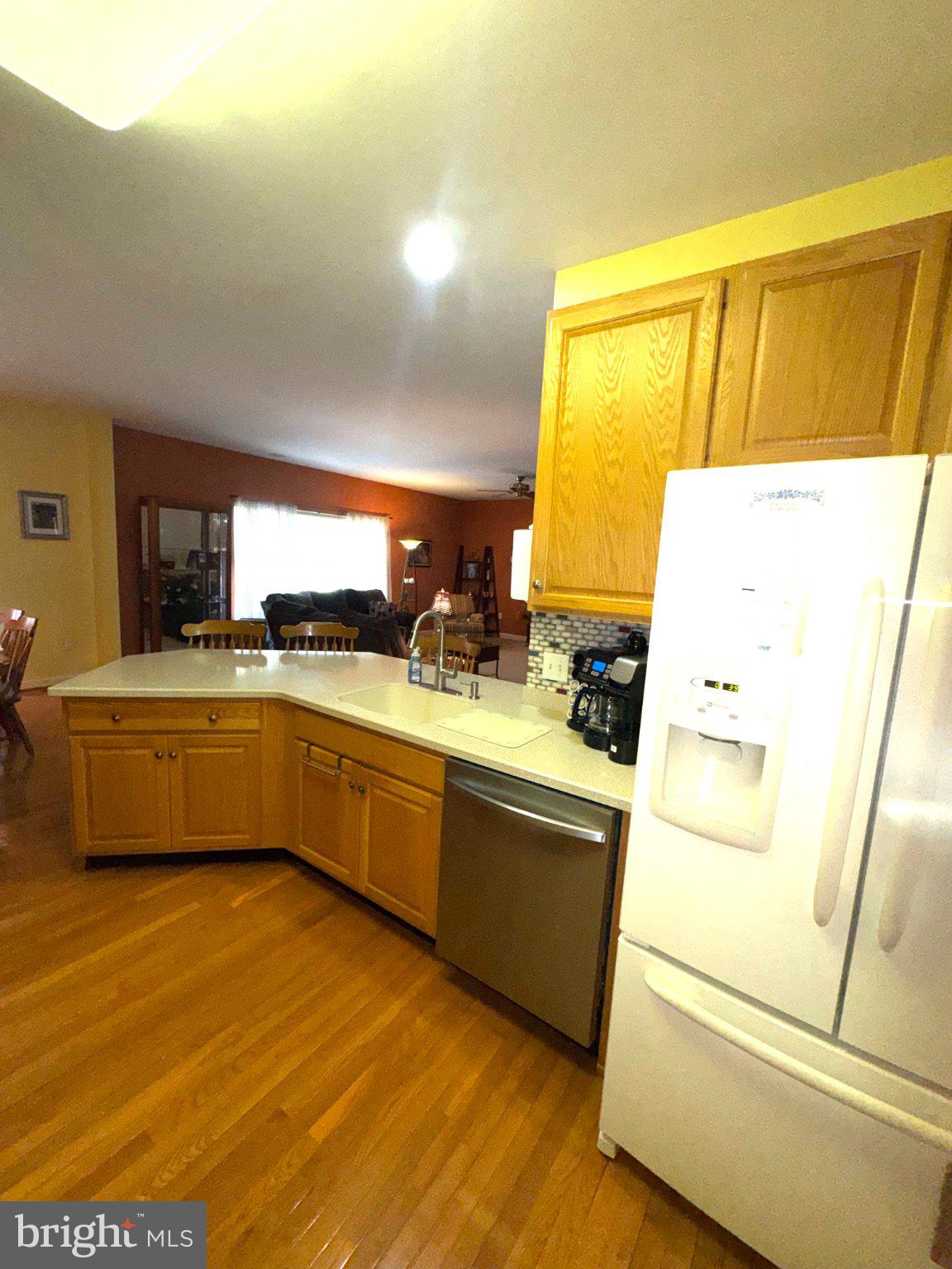231 Foxglove Loop Bear, DE 19701 - Photo 10 of 30 a kitchen with a sink a stove top oven a counter space and a window