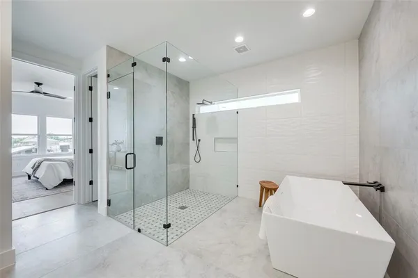 a bathroom with a shower and bathtub