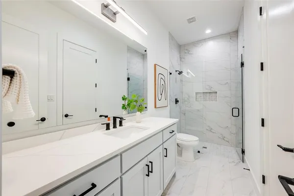 a view of living room with furniture and wooden floor