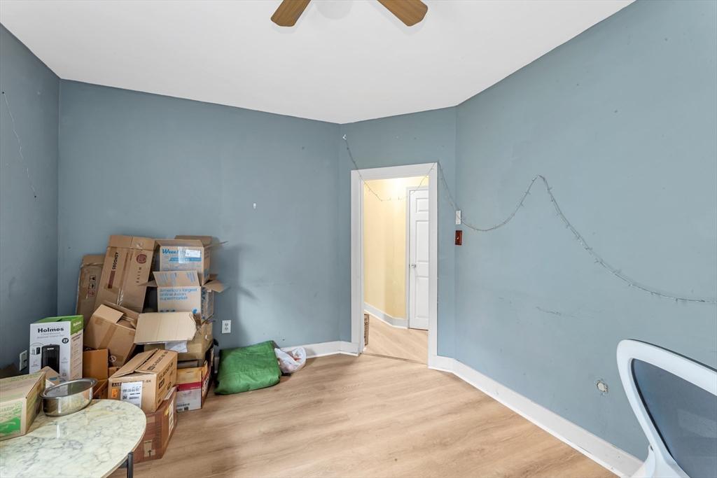 6 Wise Street, Unit 1 Boston, MA 02130 - Photo 3 of 14 a bedroom with a bed and wooden floor