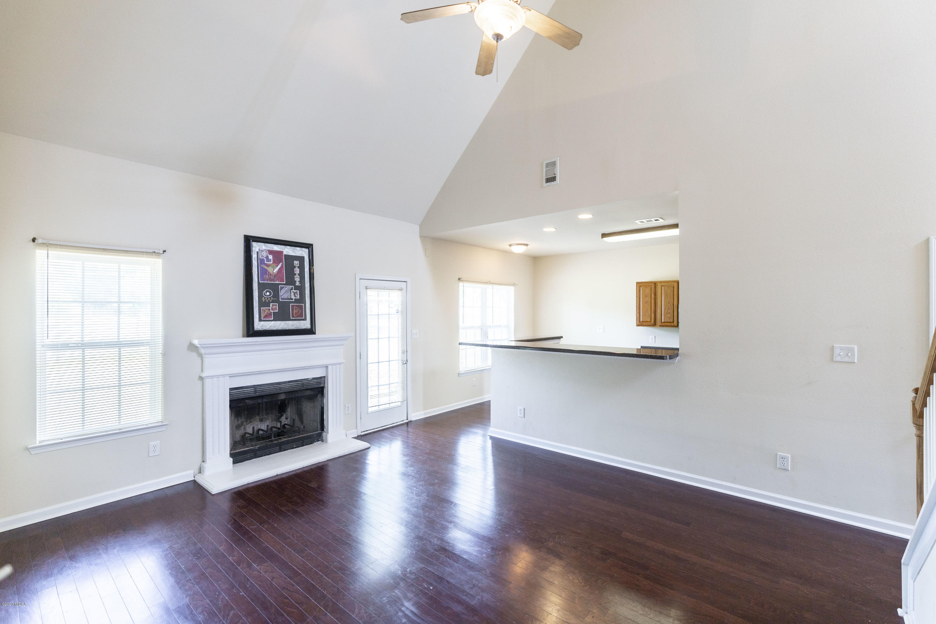 415 Bob White Road Macon, GA 31216 - Photo 14 of 43 a view of empty room with wooden floor and fireplace