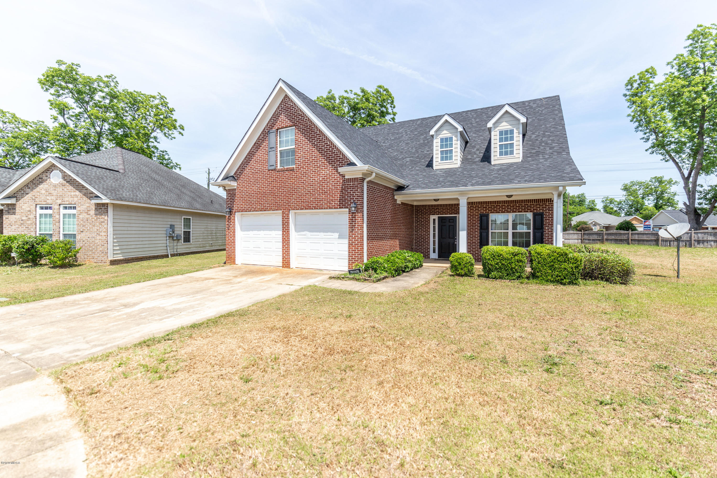 415 Bob White Road Macon, GA 31216 - Photo 3 of 43 a front view of a house with a garden