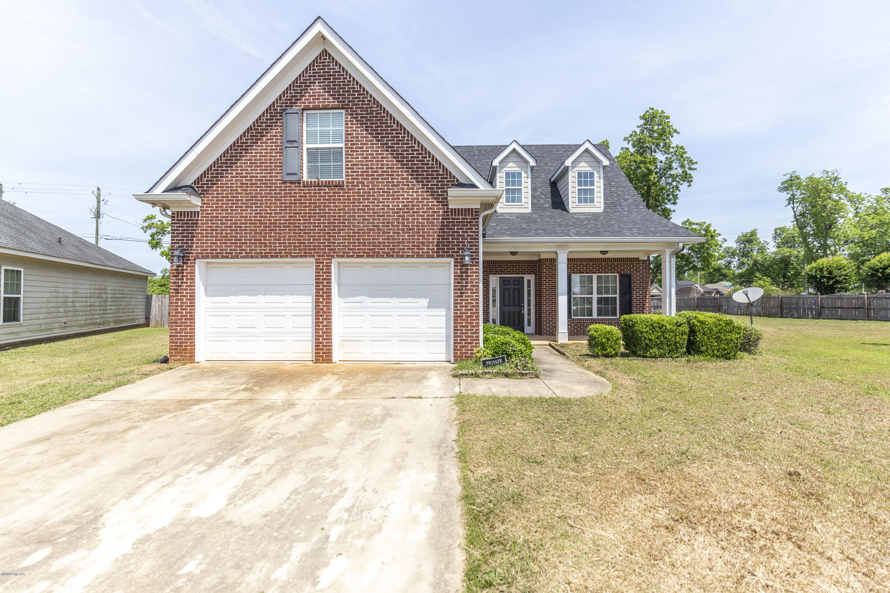 415 Bob White Road Macon, GA 31216 - Photo 5 of 43 a front view of a house with a yard and garage