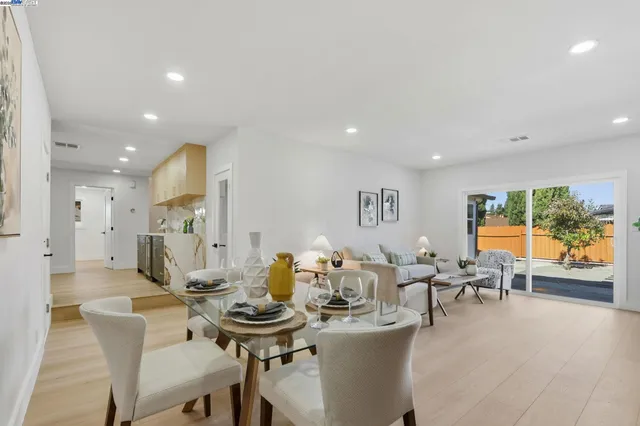 a view of a dining room with furniture window and outside view