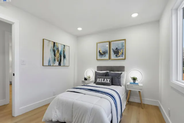 a bedroom with a bed and a window