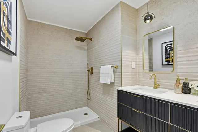 a bathroom with a sink a mirror and shower