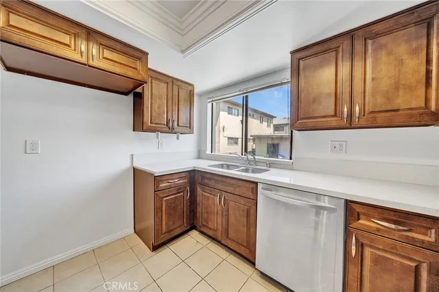 a kitchen with stainless steel appliances granite countertop a sink and cabinets