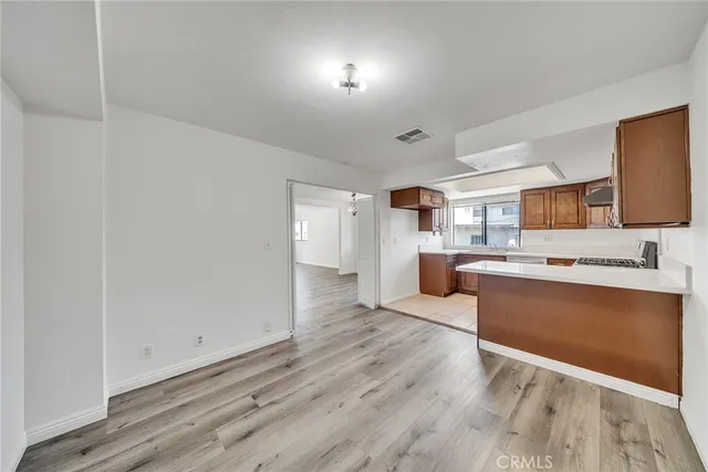 a view of kitchen with wooden floor