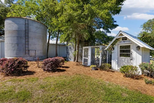 a kitchen with cabinets and chairs