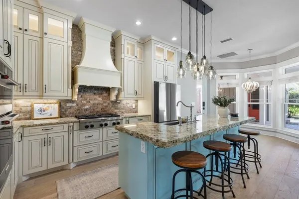 a living room with a fireplace and a flat screen tv