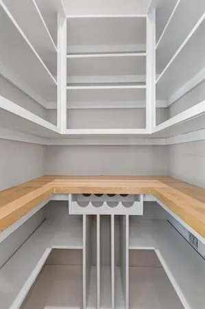 a bathroom with a granite countertop toilet a sink and shower