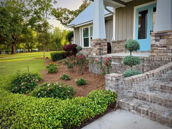 a view of a swimming pool with an outdoor space and seating area