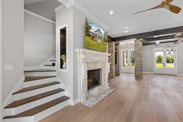 a view of living room kitchen with furniture and floor to ceiling window