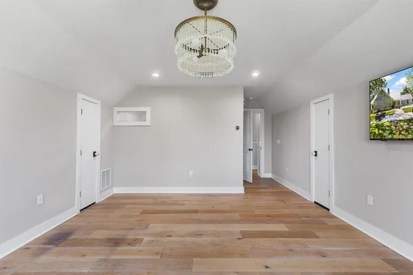 a front view of a house with a yard and porch