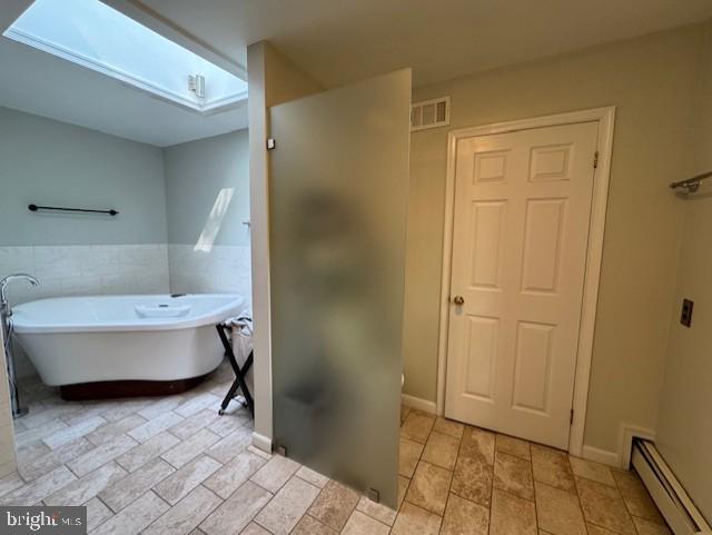 6 Branchwood Court Baltimore, MD 21208 - Photo 22 of 29 a bathroom with a bathtub and shower