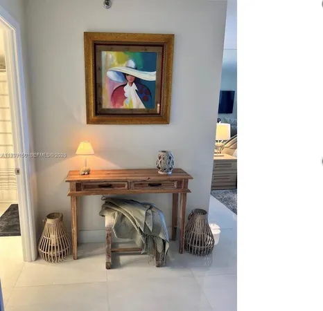 a spacious bedroom with a bed and wooden floor