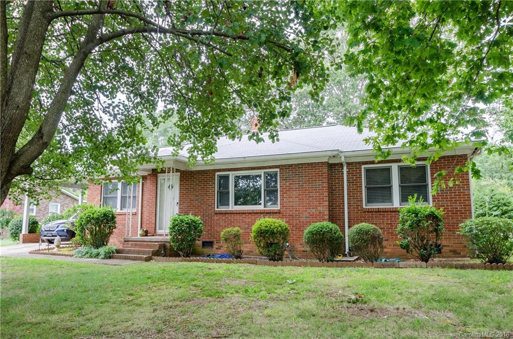 427 Fieldstone Road Mooresville, NC 28115 - Photo 1 of 17 a front view of a house with a yard and potted plants and large tree