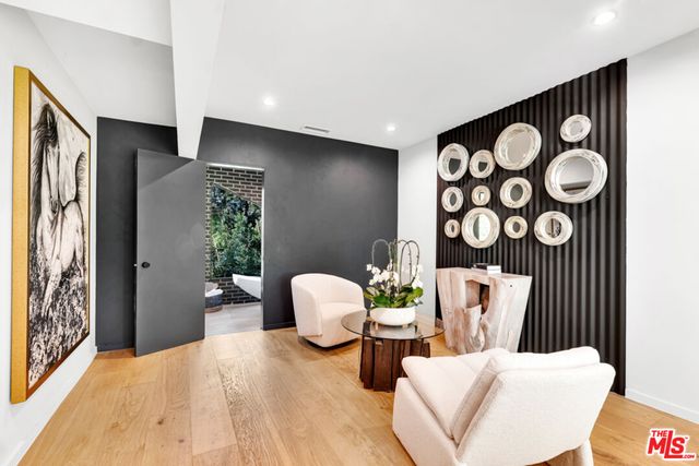 a bedroom with furniture and a window