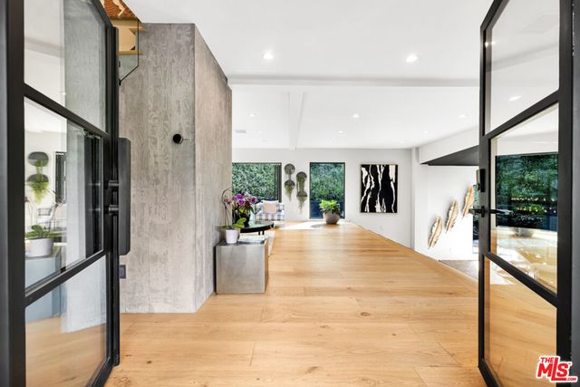 a lobby with furniture and a garden