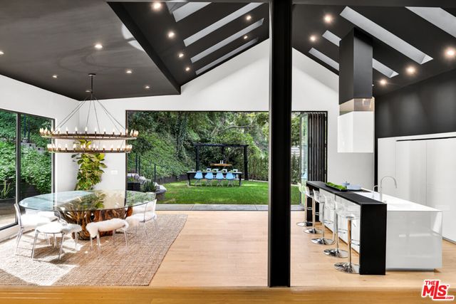 a view of a swimming pool and lounge chair