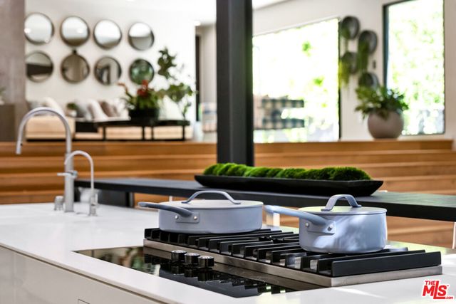 a view of a house with backyard porch and sitting area