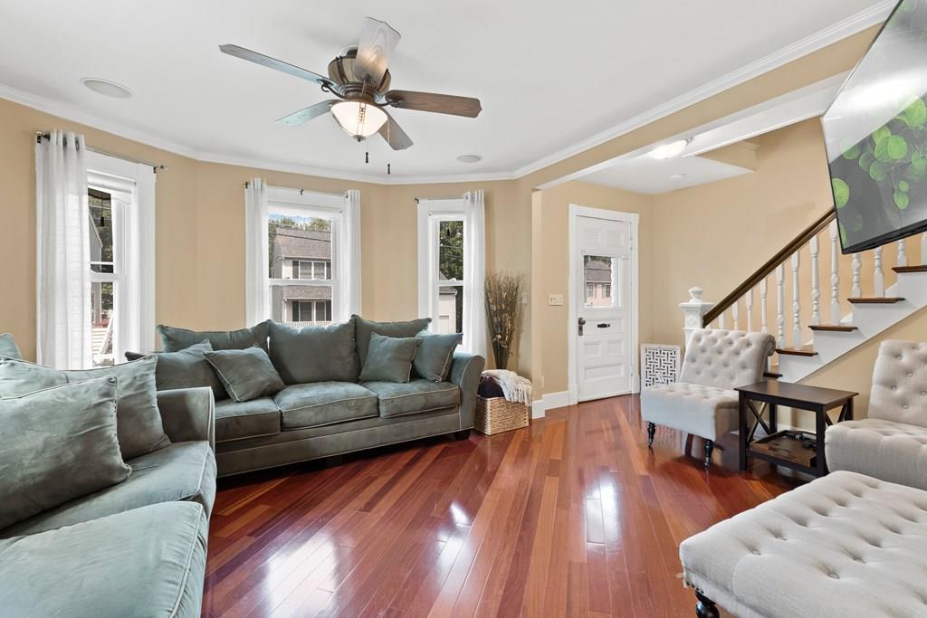 143 18th Street Lowell, MA 01850 - Photo 12 of 35 a living room with furniture and a wooden floor